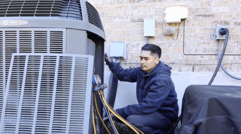 A Wright Home Services AC technician working on an outdoor condensing unit.